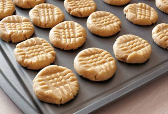 3 ingredient flourless, sugar free peanut butter cookies on baking sheet
