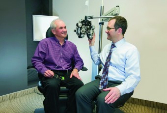Senior man getting his eyes checked at the optometrist